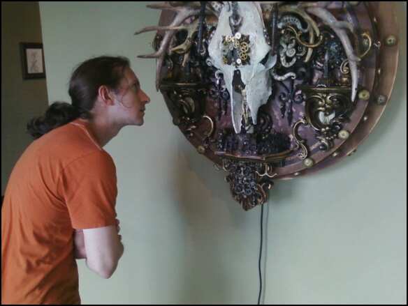 Cody examining an artwork by Michael Thomsen